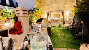 a room filled with lots of furniture and plants at LUXURY FLAT WITH PRIVATE ROOFTOP - Paris 18 in Paris