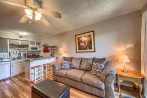 a living room with a couch and a kitchen at Sweet Retreat RRC A203 in New Braunfels