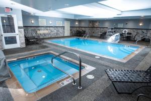 a large pool in a hotel room at Hilton Garden Inn Great Falls in Great Falls