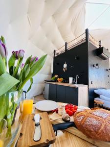 a kitchen with a table with food on it at Silence Glamp - Glamping Bieszczady in Ustrzyki Dolne