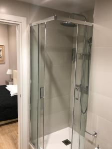 a shower with a glass door in a bathroom at Pinciano 1stfloor in Rome