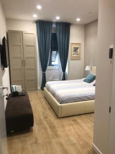 Un pat sau paturi într-o cameră la Pinciano 1stfloor
