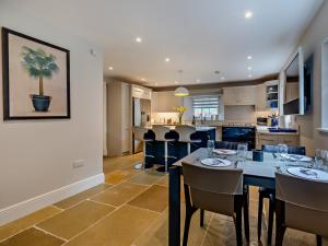 a kitchen and dining room with a table and chairs at 3 Bed in Ravenstone 94378 in Ravenstone