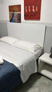 Postel nebo postele na pokoji v ubytování Hotel Alloggio Del Conte