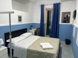 Postel nebo postele na pokoji v ubytování Hotel Alloggio Del Conte
