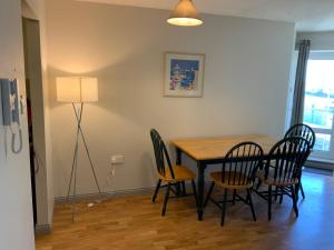 a dining room with a table and chairs at Ocean view apartment in Galway