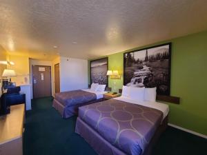 Postel nebo postele na pokoji v ubytování Horizon Hotel
