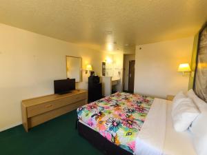 Postel nebo postele na pokoji v ubytování Horizon Hotel