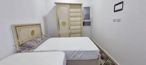 Postel nebo postele na pokoji v ubytování Sandbeach apartment