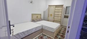 Postel nebo postele na pokoji v ubytování Sandbeach apartment