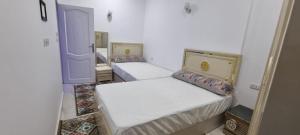 Postel nebo postele na pokoji v ubytování Sandbeach apartment