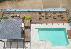 an overhead view of a swimming pool in a backyard at River Plaza Apartments Brisbane in Brisbane