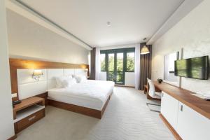 Postel nebo postele na pokoji v ubytování Hotel Porto In