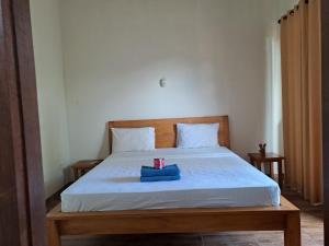 Postel nebo postele na pokoji v ubytování Kutabay Homestay