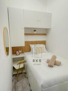 a bedroom with a bed and a chair in it at Shared Private Room in Downtown Business Bay in Dubai