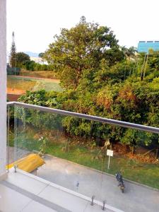 a view of a park from a balcony at Cozy Apartment in Pinares de San Martin. ¡PEREIRA! in Pereira