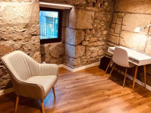 a room with a piano and a chair and a desk at Casa Boutique Marín 1910 in Marín +40 photos