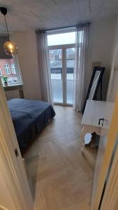 Ένα ή περισσότερα κρεβάτια σε δωμάτιο στο Luxurious Apartment In Aalborg City, Free Parking