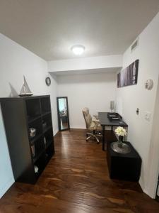 a living room with a desk and a table at Downtown Toronto Suite By The Lake in Toronto