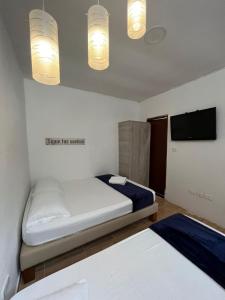 Rúm í herbergi á Hotel Coffee Real Pereira