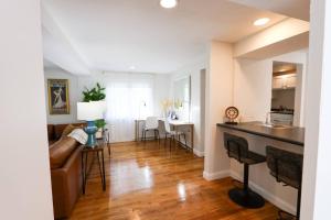 a kitchen and living room with a couch and a table at Single family,3 bed, 3 bath,Harvard, MIT,hospitals in Cambridge