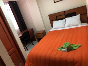 Rúm í herbergi á Tambo Cusco Inn
