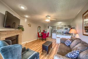 a living room with a couch and a fireplace at Sweet Retreat RRC A203 in New Braunfels