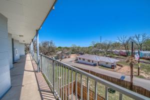 a balcony with a view of a train station at Sweet Retreat RRC A203 in New Braunfels
