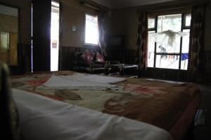 En eller flere senge i et værelse på Vamoose Cherry Resort