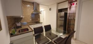 A kitchen or kitchenette at Landscape Beira Mar