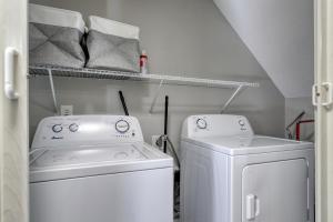 a small laundry room with a washer and dryer at 1408 Perrin Dr, Unit A - Ocean Walk Sleeps 8 in Myrtle Beach