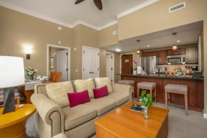 a living room with a couch and a kitchen at KBM Resorts: Honua Kai HKH-114 1Bd w Rental Car in Kaanapali