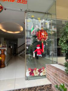 a santa claus window display in a shopping mall at Phung Long Hotel in Ho Chi Minh City
