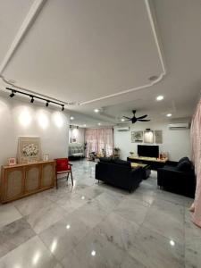 a living room with couches and a ceiling at Cozy 2StoreyHome 5Room11Pax@ChaiLengPark in Perai