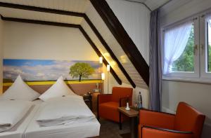 Postel nebo postele na pokoji v ubytování Hotel Ratskeller