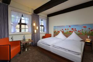 Postel nebo postele na pokoji v ubytování Hotel Ratskeller