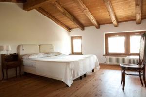 Кровать или кровати в номере La Casa Griunit