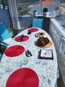 a table on a balcony with food on it at Marine View in Nea Peramos