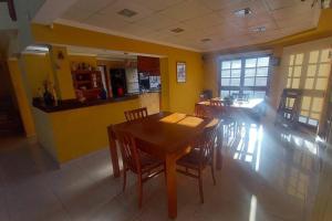 a dining room with a wooden table and chairs at comodidad y tranquilidad in Jesús María