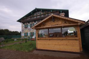 
a food stand with a sign on the side of it at Hotel Muravskiy Trakt in Zhdanov

