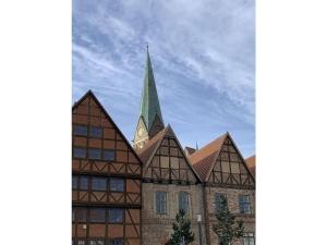 a building with a church with a steeple at CATHEDRAL WHISPERS Modern retreat in Schwerin