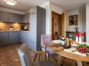 a kitchen and dining room with a table and chairs at Angerer - the holiday apartment 2 in Berchtesgaden