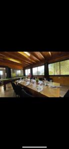 a large dining room with a long table with chairs at הוילה הסודית שלי in Kefar H̱ananya +6 photos