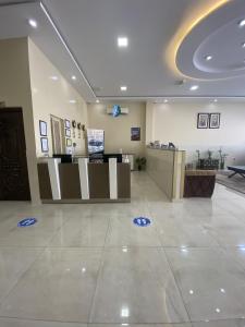 a lobby with a waiting room with a counter at Sohar Hotel - فندق صحار in Sohar