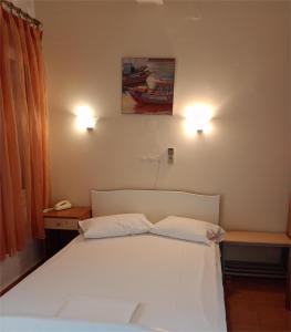 Postel nebo postele na pokoji v ubytování Efstratios Hotel