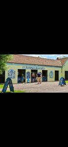 two pictures of a building with people in front of it at La Tiny house in Ardres