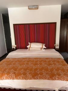 Postelja oz. postelje v sobi nastanitve Family Hotel Zhangjiajie