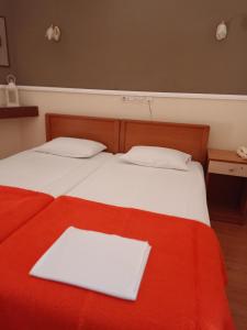 Postel nebo postele na pokoji v ubytování Efstratios Hotel