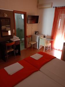 Postel nebo postele na pokoji v ubytování Efstratios Hotel