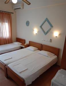 Postel nebo postele na pokoji v ubytování Efstratios Hotel